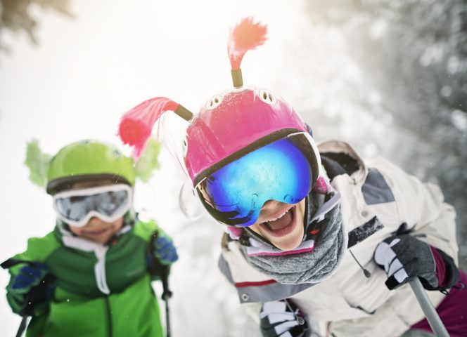 Kids skiing on a beautiful winter day